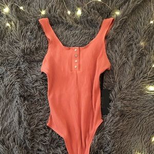Pink body suit